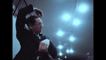 audionetwork dancing friday feeling office dance audio network GIF