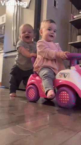 Baby Boy Belly Laughs While Pushing Twin Sister GIF by ViralHog