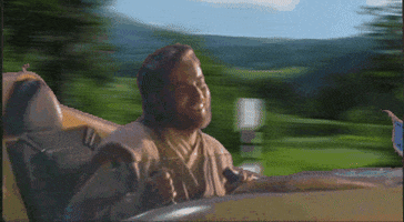 Star Wars gif. Anakin Skywalker, bobbing around happily, pilots a mini spaceship through a beautiful landscape, passing various Star Wars characters as he goes.
