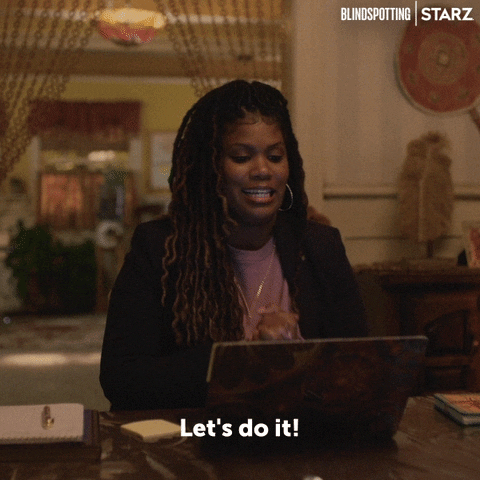 TV gif. In a scene from Blind Spotting, a woman with dreadlocks sits at a desk in a well-decorated room. She happily looks at her laptop while bouncing in a little victory dance. Text, "Let's do it!"