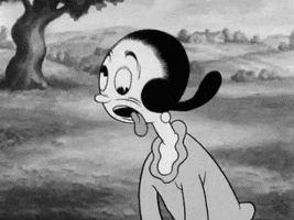 TV gif. In black and white, a confused and exasperated Olive Oyl from Popeye rolls her eyes around as her tongue hangs out of her mouth.