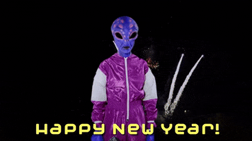 Video gif. Someone dressed as a purple and pink spotted alien in a purple track suit shoots a laser gun in a cloud of confetti and fireworks. Text, "Happy New Year!"