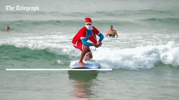 santa surfing GIF by The Telegraph