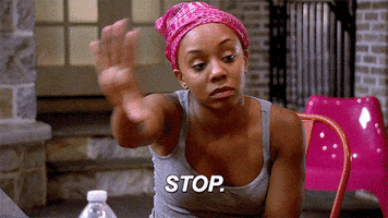 TV gif. Young woman wearing a pink hair bonnet and a gray tank top holds up a hand saying, "Stop."