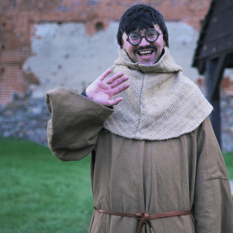 Celebrity gif. YouTuber Cyber Marian wearing medieval-style clothing, smiling and waving.