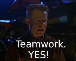 Movie gif. William H Macy as Shoveler in Mystery Men gives a hard stare and says emphatically, "Teamwork. Yes!" 