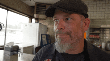 Knowing Grin GIF