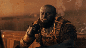 Video game gif. Brok in God of War leans on a table and starts laughing. He claps then leans back on the table pointing at the person across from him.