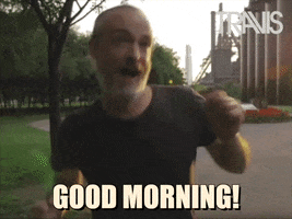 Video gif. Fran Healy, frontman of the band Travis jumps up and down giddy with excitement. Text, Good Morning!"