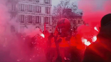 Protesters Light Flares in Central Paris Amid Nationwide Labor Strikes