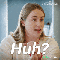 Sponsored gif. Reality star Whitney Leavitt from the reality show “The Secret Lives of Mormon Wives” blinks rapidly and shakes her head in disbelief. Text in front of her reads, “Huh?”