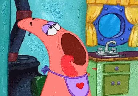 SpongeBob gif. Patrick wears an apron in a kitchen with an open mouth as he hungrily licks his lips. 