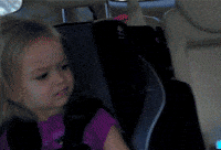 Meme gif. Young blonde girl, Chloe, in a car seat looks at us with a judgmental or disapproving side-eyed expression, darting her eyes back and forth like she doesn't get what you're about at all.