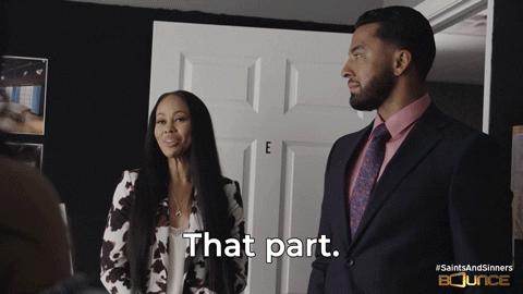 TV gif. Kaye Singleton as Josie and Christian Keyes as Levi from Saints and Sinners glance at each other as she smiles at him. He rolls his eyes in embarassed disbelief as he mouths the words that read. Text, "That part."