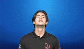 Video gif. Young man shakes his head side to side while saying, "Say whaat?!," which appears as floating text behind him. Faded, white question marks appear above his head.