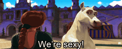 Movie gif. Donkey from Shrek has been transformed into a white horse and smiles at Princess Fiona and says, “We’re sexy!”