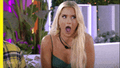 Reality TV gif. Contestant on Love Island has her jaw totally dropped as she gasps and looks around.