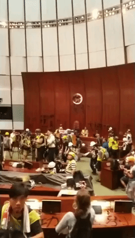 Protesters Occupy Hong Kong Legislative Building Chamber, Covering Walls in Graffiti