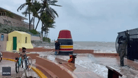People Pose for Photos as Large Waves Pound Key West