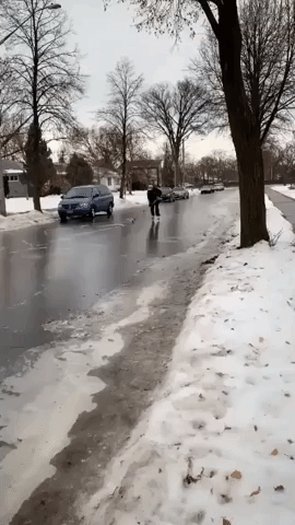 Minneapolis Man Uses Icy Road for Hockey Practice