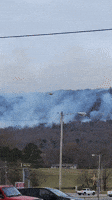 Helicopter Assists Firefighters Battling Blaze on Tennessee Mountain