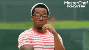 TV gif. A man from Master Chef in a striped shirt and hat strokes his beard and nods affirmingly.