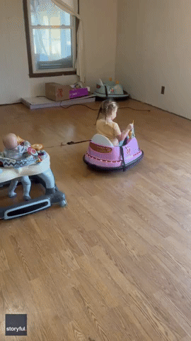 Little Girl Comes Up With Makeshift Ride to Entertain Baby Brother