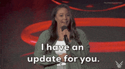 Video gif. On the 2024 Summer Game Fest stage, a female presenter, wearing an open green button-down shirt with a white t-shirt underneath, speaks into the microphone she holds in her left hand. She says,  'I have an update for you.' The caption at the bottom of the gif reads the same.
