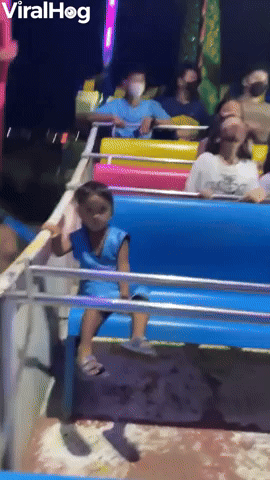 Child Just Chills on Amusement Park Ride   