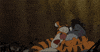Disney gif. An excited Tigger tightly hugs Eeyore's head, but Eeyore seems vaguely uncomfortable.