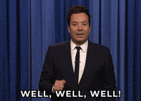 Tonight Show gif. Jimmy Fallon has a slight smile as he tilts his head and says, "Well, well, well."