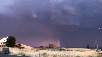Lightning Flashes as Rainbow Shines in Central California Sky
