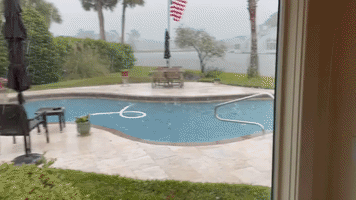 Hailstones Splash Into Pool During Storm in Ponte Vedra Beach, Florida