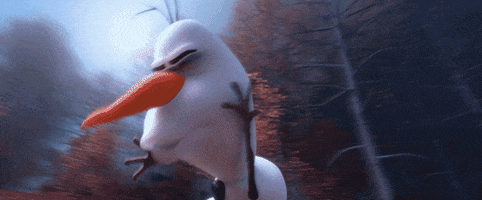 Cartoon gif. Olaf from Frozen is running in a forest while surroundings fly up around him. The angle is shot from below so we look up at him as he runs away from multi-colored fire exploding around him, rocks being thrown, and geysers going off.