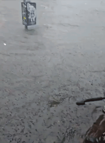 Floodwater Covers Bike Wheels as Torrential Rain Inundates Brooklyn
