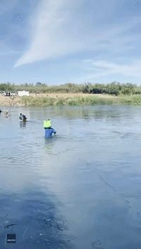 National Guard Throw Rope to Migrants Caught in Rio Grande Current