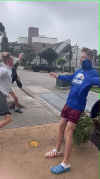 Boys Brace Themselves Against Strong Winds as Ian Hits Myrtle Beach