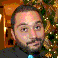 Video gif. We zoom in on a man’s face as he smugly smirks. Text, “Oh hai.”