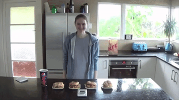 Competitive Eater Nela Chows Down on Three Burgers in 100 Seconds