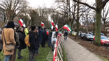 Protesters With Iranian Flags Gather Outside Consulate in Hamburg
