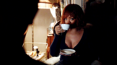 TV gif. Rihanna as Marion in Bates Motel takes a sip of tea then looks down and shakes her head disapprovingly.