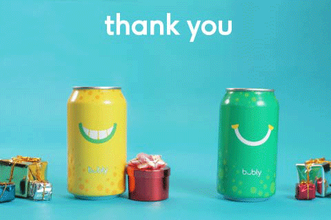 Ad gif. Yellow "bubly" sparkling water can and a green can are surrounded by presents. Yellow can smiles and gives the green can a red present. The green can dances around with happiness. Text, “Thank you!”