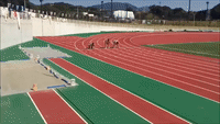 Sumo Wrestlers Sprint Down Race Track