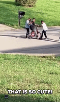 Mom Watches Her Son Learn How To Ride A Bike