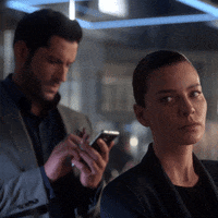 lucifernetflix netflix phone shrug lucifer GIF