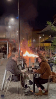 Raging Protest Fire Doesn't Stop Bordeaux Cafe Diners From Enjoying Wine