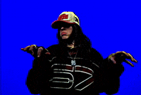 Music Video gif. From Billie Eilish's music video for "LUNCH". Billie is on a bright blue background wearing a black shirt with the number 67 written on it in white, as well as a white and red hat over her straight black hair. She is pretend playing the piano as the camera shakes.