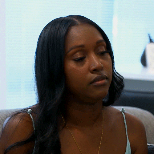 Reality TV gif. A cast member from Married at First Sight rolls her eyes heavily, sighing and looking away.