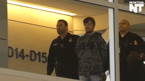 guess who's back handcuffs GIF by NowThis 