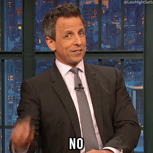 Late Night gif. Seth Meyers smiles sarcastically as he points a stern finger at us. Text, "No."